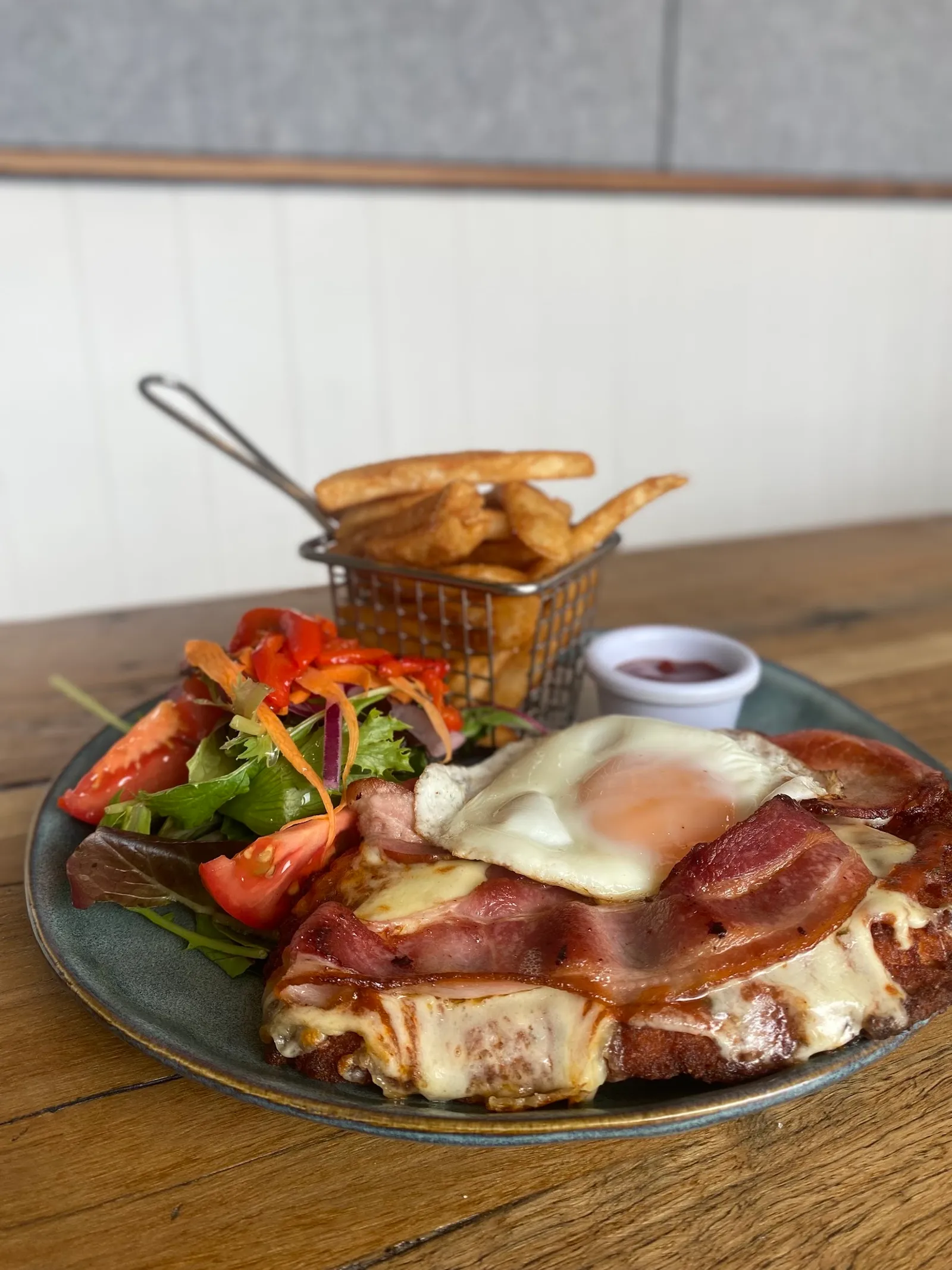 Chicken parmigiana with side salad and chips