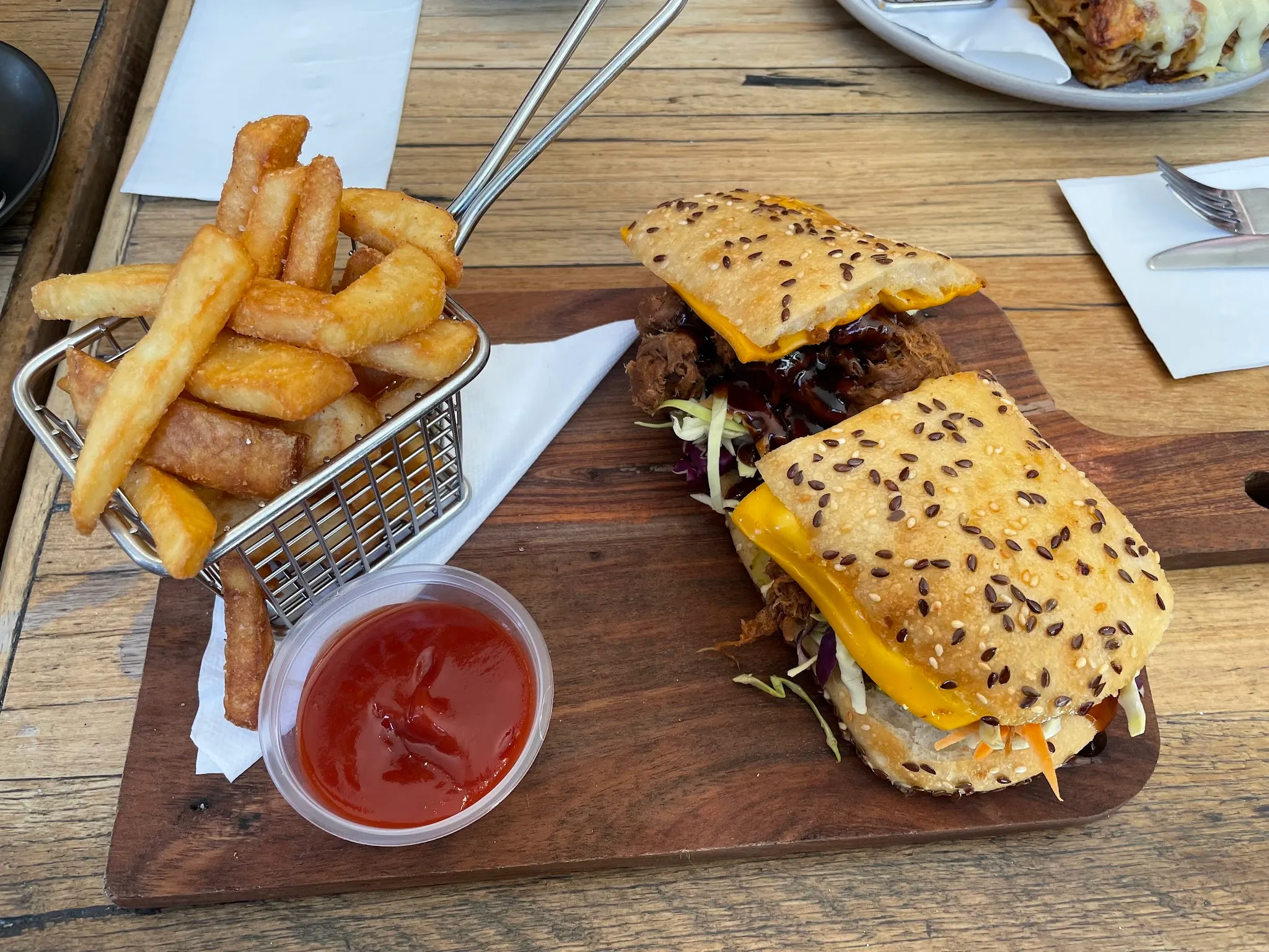 Pulled pork and cheese sandwich with fries and tomato sauce