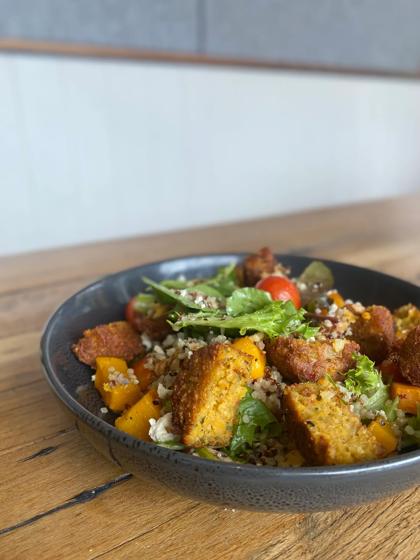 Falafel and quinoa salad bowl with roasted pumpkin and feta